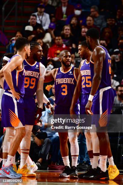 Devin Booker, Jae Crowder, Chris Paul, Mikal Bridges, and Deandre Ayton of the Phoenix Suns huddle up during the game against the Houston Rockets on...