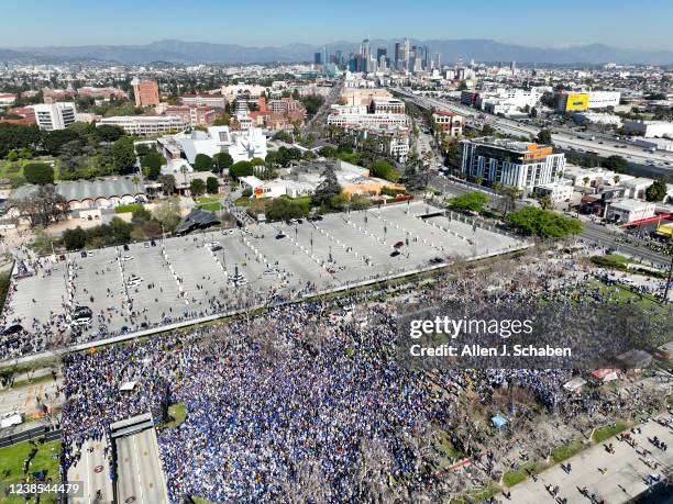 Los Angeles, CA An aerial view with a view of downtown Los Angeles of crowds celebrating the Los Angeles Rams Super Bowl Championship parade and...