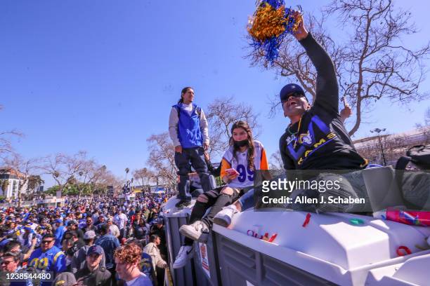 Los Angeles, CA Fans get a high view on top of portable bathrooms as they celebrate the Los Angeles Rams Super Bowl Championship parade and rally,...