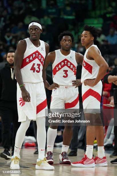 Pascal Siakam, OG Anunoby and Scottie Barnes of the Toronto Raptors look on during the game against the Minnesota Timberwolves on February 16, 2022...