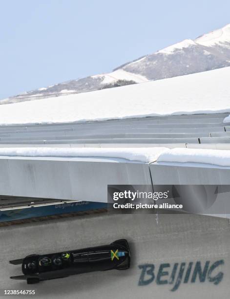 February 2022, China, Yanqing: Olympics, bobsleigh, four-man bobsleigh, training, men at the National Sliding Centre, Jamaica's bobsleigh pilot...