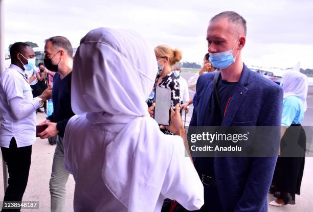 Airport staff scans tourists with EDE device after they arrive at Abeid Amani Karume International Airport in Zanzibar Island, Tanzania on February...