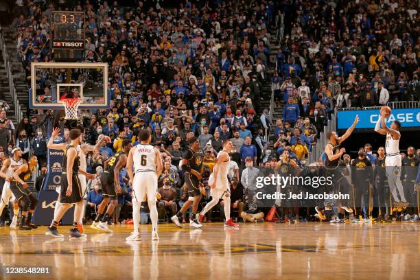 Monte Morris of the Denver Nuggets shoots a game-winning three-point-basket during the game against the Golden State Warriors on February 16, 2022 at...