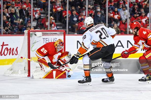 Calgary Flames Goalie Jacob Markstrom makes a pad save against Anaheim Ducks Left Wing Nicolas Deslauriers during the third period of an NHL game...