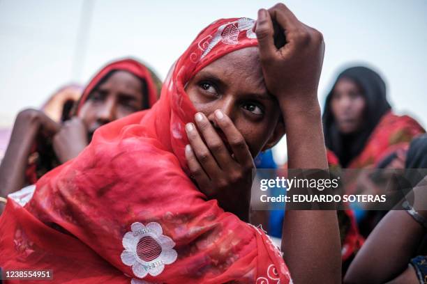 An internally displaced woman looks on in a school in the village of Afdera, 225 kms of Semera, Ethiopia, on February 15, 2022. More than fifteen...