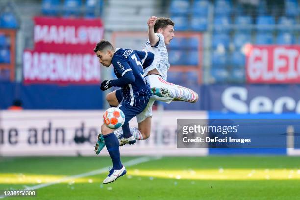 Danilo Soares of VfL Bochum and Benjamin Pavard of Bayern Muenchen battle for the ball during the Bundesliga match between VfL Bochum and FC Bayern...