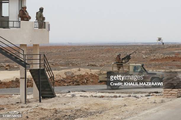 Picture taken during a tour origanized by the Jordanian Army shows soldiers patrolling along the border with Syria to prevent trafficking, on...