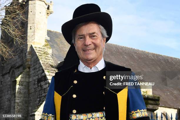 French businessman, chairman and CEO of the investment group Bollore, Vincent Bollore poses in a traditional outfit during a ceremony marking the...