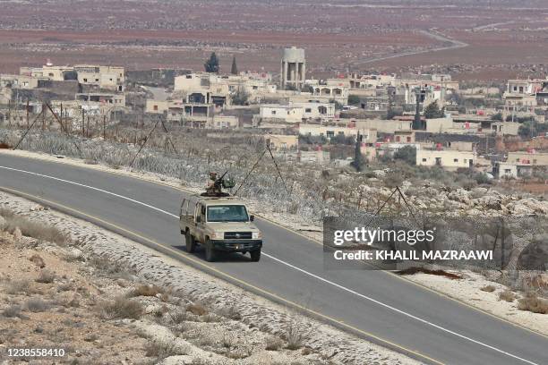 Picture taken during a tour origanized by the Jordanian Army shows soldiers patrolling along the border with Syria to prevent trafficking, on...