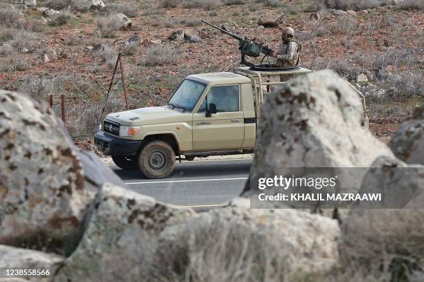 Picture taken during a tour origanized by the Jordanian Army shows soldiers patrolling along the border with Syria to prevent trafficking, on...