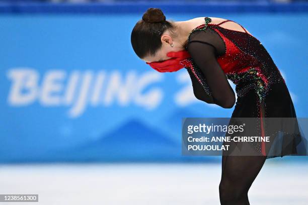 Russia's Kamila Valieva reacts after competing in the women's single skating free skating of the figure skating event during the Beijing 2022 Winter...