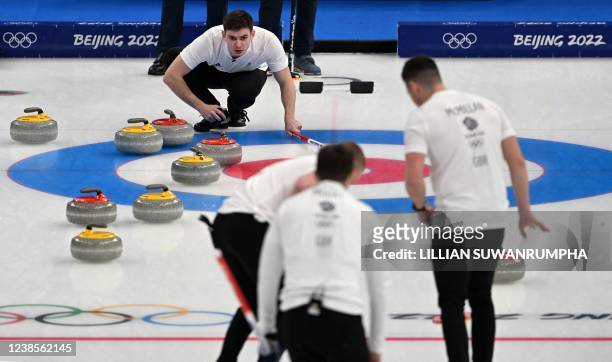 Britain's Bobby Lammie guides his team into the house during their men's semifinal game of the Beijing 2022 Winter Olympic Games curling competition...
