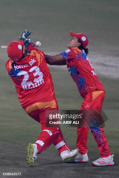 Islamabad United's Muhammad Musa and wicketkeeper Azam Khan attempt a catch of Peshawar Zalmi's Yasir Khan during the Pakistan Super League Twenty20...