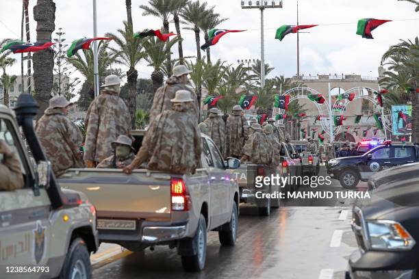 Libya's security forces parade at the Martyrs' Square in the capital Tripoli on February 17 as Libyans commemorate the 11th anniversary of the...