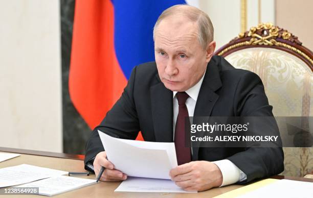 Russia's President Vladimir Putin chairs a meeting on economic issues in Moscow on February 17, 2022.