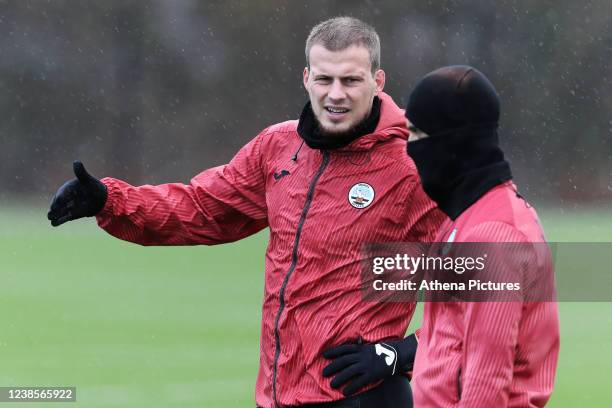 Ryan Bennett speaks with Yan Dhanda during the Swansea City Training Session at The Fairwood Training Ground on February 17, 2022 in Swansea, Wales.