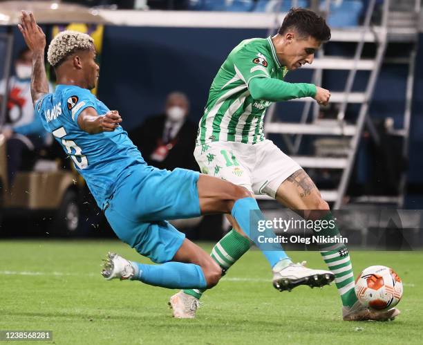 Wilmar Barrios of Zenit St. Petersburg and Cristian Tello of Real Betis battle for the ball during the UEFA Europa League Knockout Round Play-Offs...