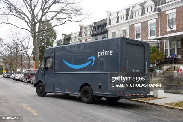 An Amazon Prime truck pulls away after a delivery in Washington, DC, on February 17, 2022. US retail sales boomed in January as shops more than...