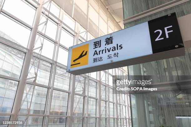 Arrivals sign inside the International Terminal of Haneda Airport. Japans Prime Minister Fumio Kishida announced at his press Conference on February...