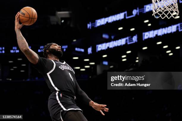 Andre Drummond of the Brooklyn Nets dunks the ball against the Washington Wizards during the first half at Barclays Center on February 17, 2022 in...