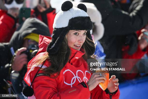 China's Gu Ailing Eileen wear a panda-themed hat after winning the freestyle skiing women's freeski halfpipe final run during the Beijing 2022 Winter...