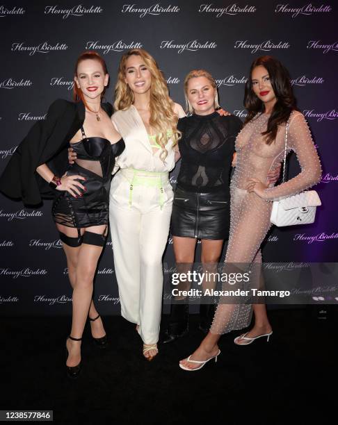 Tiah Eckhardt, Carmen Carrera, Eloise Monaghan and Zita Vass are seen at the Honey Birdette flagship boutique at Aventura Mall on February 17, 2022...