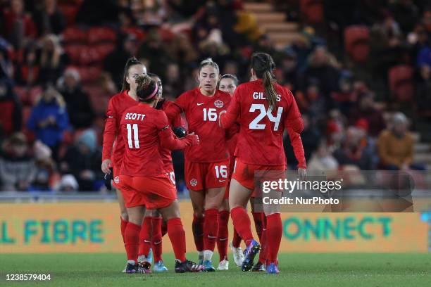 Janine Beckie of Canada celebrates with her team mates after scoring to make it 1-1 during the Arnold Clark Cup match between England Women and...