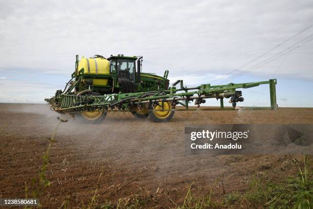 Tractor sprays the soybean field in Goias, Brazil on February 12, 2022. Brazil's Congress approves a bill to allow commercialization of pesticides...