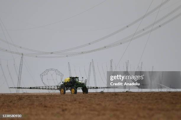 Tractor sprays the soybean field in Goias, Brazil on February 12, 2022. Brazil's Congress approves a bill to allow commercialization of pesticides...