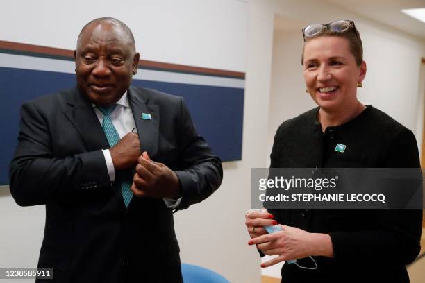 Danish Prime Minister Mette Frederiksen and South Africa's President Cyril Ramaphosa pose ahead of a meeting on the second day of a European Union...