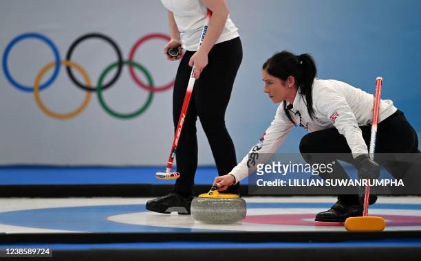 Britain's Eve Muirhead curls the stone during the women's semifinal game of the Beijing 2022 Winter Olympic Games curling competition against Sweden...