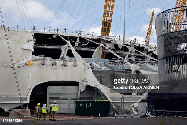 Wind-damaged sections of the roof of The O2 Arena, formerly the Millennium Dome, are pictured in London, on February 18 as Storm Eunice batters the...