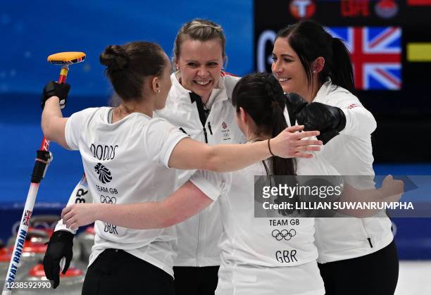 Britain's Jennifer Dodds, Victoria Wright, Hailey Duff and Eve Muirhead celebrate after defeating Sweden 12-11 in an extra end in their women's...