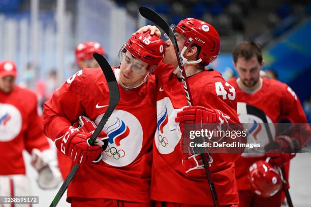 Pavel Karnaukhov of Russia and Damir Sharipzyanov of Russia celebrate after men's ice hockey playoff semifinal match between ROC and Sweden during...