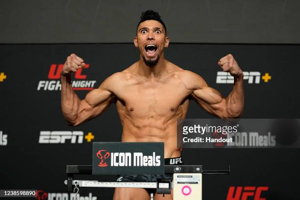 In this UFC handout, Johnny Walker of Brazil poses on the scale during the UFC Fight Night weigh-in at UFC APEX on February 18, 2022 in Las Vegas,...