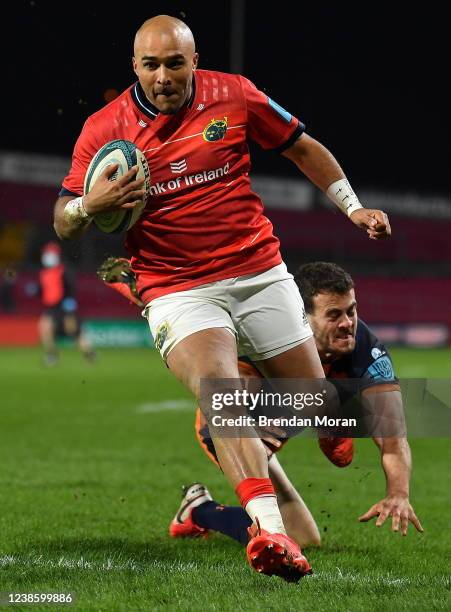 Limerick , Ireland - 18 February 2022; Simon Zebo of Munster runs in his second, and his side's third, try despite the efforts of Emiliano Boffelli...