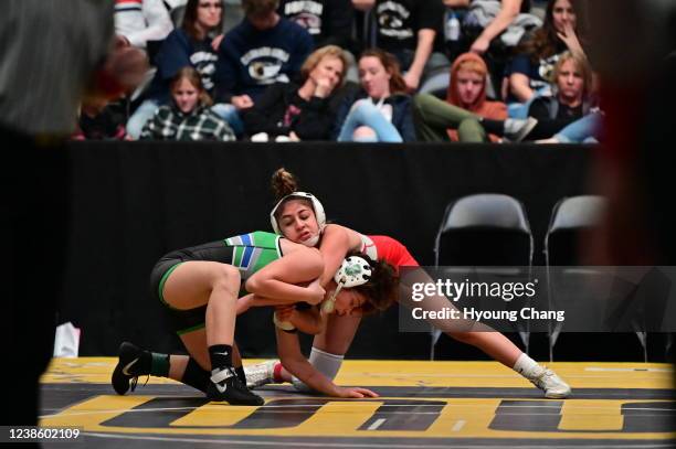 Israel Resendez of East High School, top, controls Naomi Kidd of Doherty High School during 118 pound class Girls quarterfinal of state wrestling...