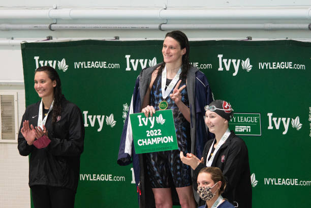 University of Pennsylvania swimmer Lia Thomas smiles on the podium after winning the 200 yard freestyle during the 2022 Ivy League Women's Swimming...