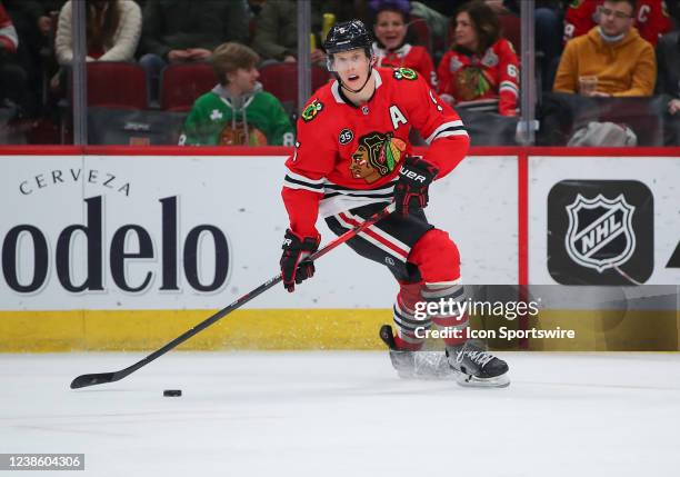 Chicago Blackhawks defenseman Connor Murphy skates with the puck in action during a game between the Dallas Stars and the Chicago Blackhawks on...