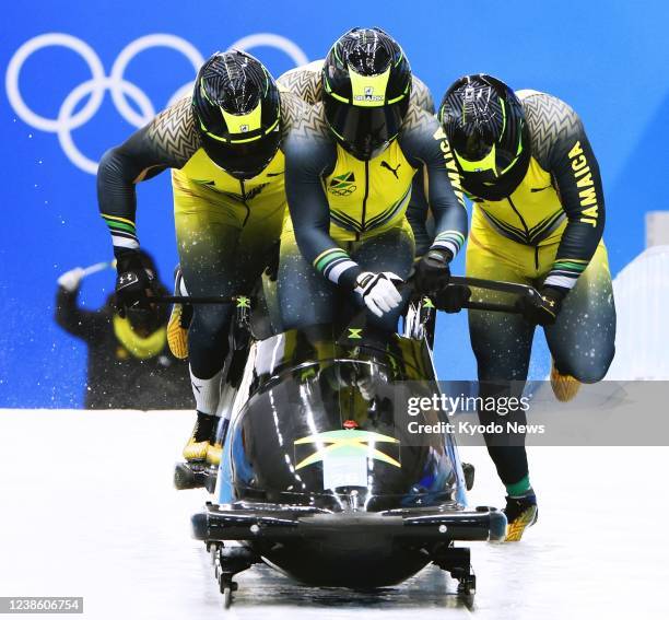 Jamaica's team starts its second run in the four-man bobsleigh at the Beijing Winter Olympics on Feb. 19 at the National Sliding Centre in the...