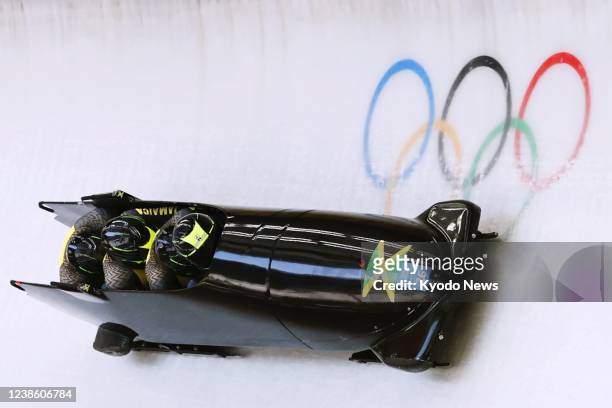 Jamaica's team competes in the four-man bobsleigh at the Beijing Winter Olympics on Feb. 19 at the National Sliding Centre in the Yanqing competition...