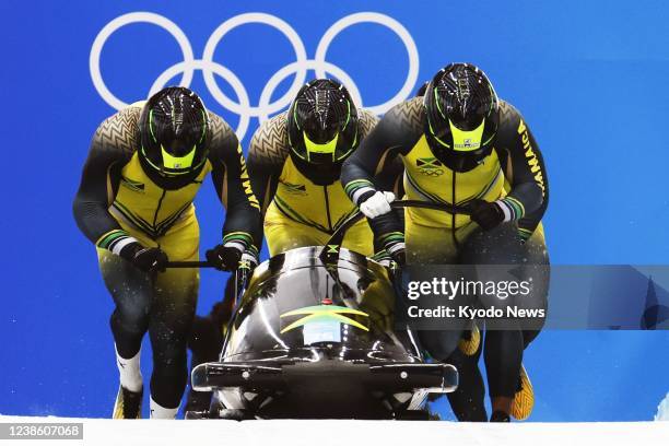 Jamaica's team starts its second run in the four-man bobsleigh at the Beijing Winter Olympics on Feb. 19 at the National Sliding Centre in the...