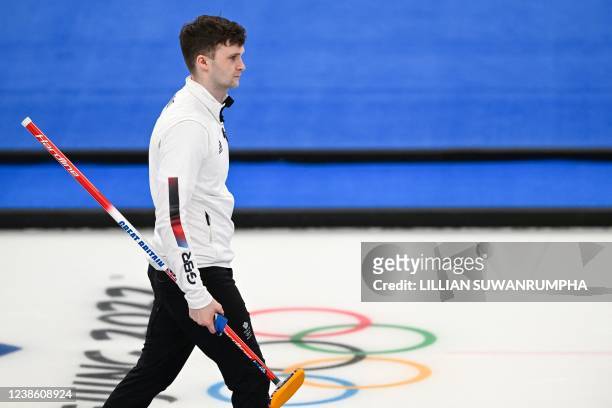 Britain's Bruce Mouat reacts after losing the men's gold medal game of the Beijing 2022 Winter Olympic Games curling competition between Sweden and...