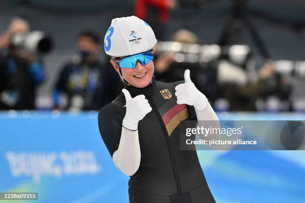 February 2022, China, Peking: Olympics, speed skating, mass start, women, final, National Speed Skating Oval, Claudia Pechstein of Germany shows...