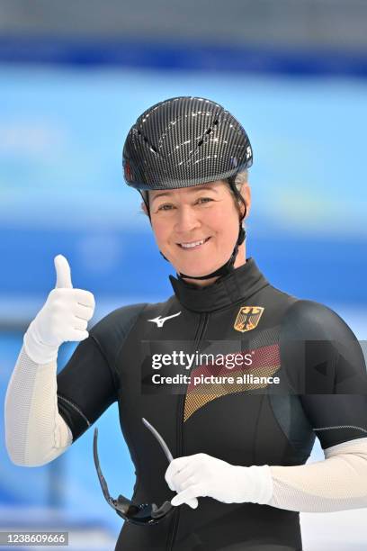 February 2022, China, Peking: Olympics, speed skating, mass start, women, semifinals, National Speed Skating Oval, Claudia Pechstein of Germany gives...