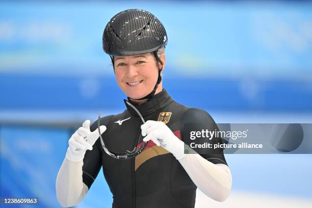 February 2022, China, Peking: Olympics, speed skating, mass start, women, semifinals, National Speed Skating Oval, Claudia Pechstein of Germany puts...