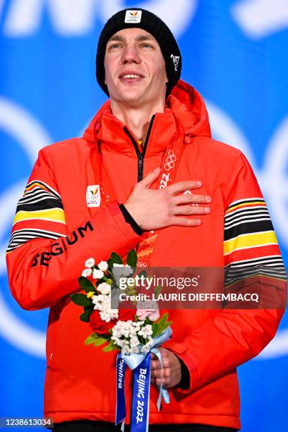 Belgian speed skater Bart Swings, winner of the gold medal celebrates on the podium during the medal ceremony of the men's mass start speed skating...