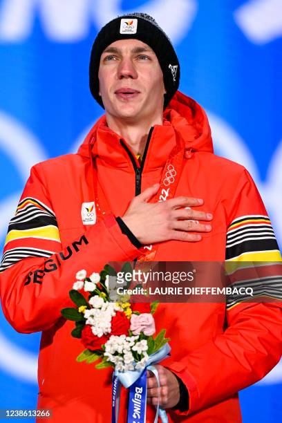 Belgian speed skater Bart Swings, winner of the gold medal celebrates on the podium during the medal ceremony of the men's mass start speed skating...
