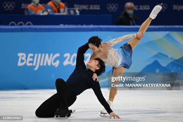 China's Sui Wenjing and China's Han Cong compete in the pair skating free skating of the figure skating event during the Beijing 2022 Winter Olympic...