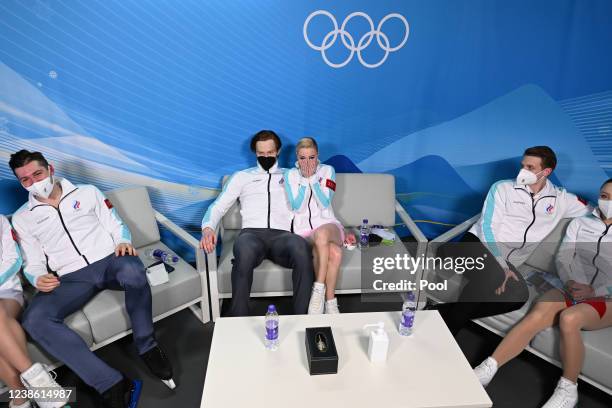 Silver medallists Russia's Evgenia Tarasova and Russia's Vladimir Morozov react in the Green Room after competing in the pair skating free skating on...